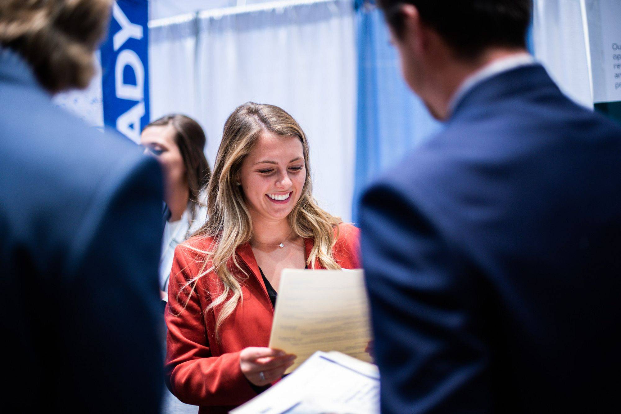 A student speaks with an employer at the GVSU Career Fair